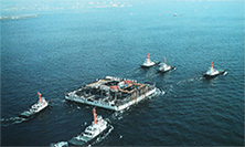 Image of Towing the concrete barge